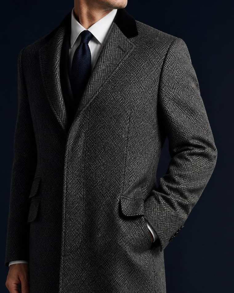 Black velvet collar and lapel of a grey herringbone Chesterfield